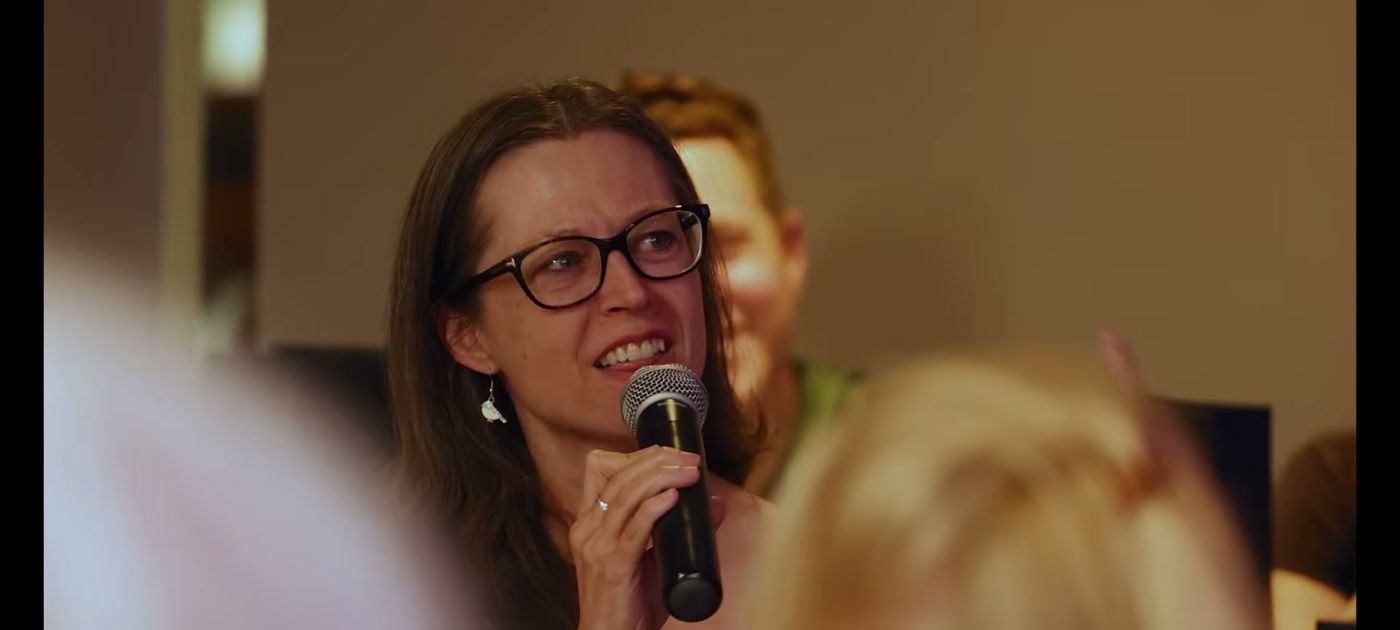 A delegate speaking on the microphone