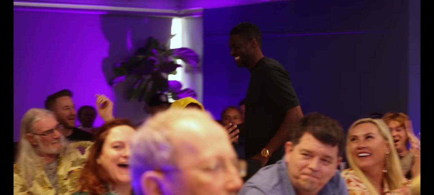 Delegates laughing during a session